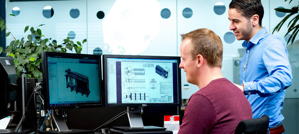 Employees looking at screen with drawing